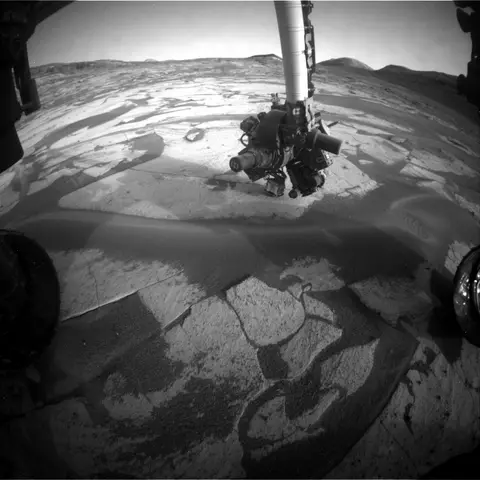 Raw image from Curiosity’s Front Hazard Avoidance Camera (Hazcam), sol 5,038