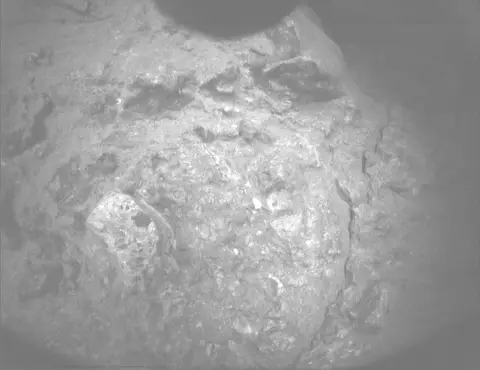 Raw image from Perseverance’s PIXL Micro Context Camera, sol 1,999